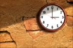 Clock On The Old Wall Cement Stock Photo