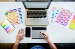 Top View Of A Young Graphic Designer Working On A Desktop Comput Stock Photo