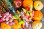 Background Of Fruit And A Bottle Of Juice Stock Photo