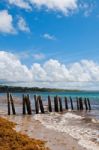 Pier Stilts On Beach Stock Photo