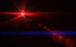 Red Digital Lens Flare In Black Background Horizontal Stock Photo