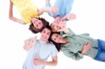 Friends Lying Down With Thumbs Up Stock Photo