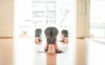 Asian Woman Doing Yoga Indoors Stock Photo