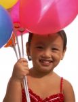 Small Kid Holding Balloons Stock Photo