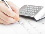 Bookkeeping With Calculator  Stock Photo