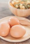 Fresh Eggs On Wooden Plate With Fusili Stock Photo