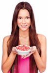 Woman Holding Pomegranate On Plate Stock Photo