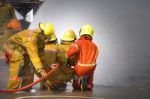 Fireman. Firefighters Fighting Fire During Training Stock Photo