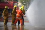 Fireman. Firefighters Fighting Fire During Training Stock Photo