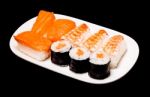 Sushi In White Plate On Black Background Stock Photo