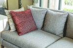 Living Room With Row Of Pillows On Sofa At Home Stock Photo