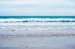 Sand Beach With Blue Ocean Stock Photo