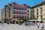 Tourists Walking Across The Plaza De Obispo In Malaga Stock Photo