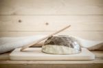 Brown Bowl With Spoon On Wooden Background Stock Photo