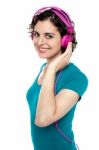 Pretty Young Woman Enjoying Music Stock Photo