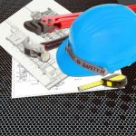 Blue Hard Hat On Blueprint Stock Photo