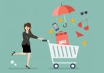 Business Woman Add Clothing And Accessories Into Cart Stock Photo