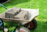 Pile Of Paving Slabs Lying In A Wheelbarrow Stock Photo