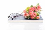 Work Space With Notebook,glasses And Rose Bouquet Isolated On Wh Stock Photo