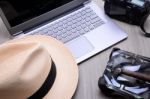 Closeup Of A Wooden Table With Laptop Stock Photo