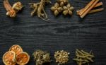 Dried Herbs And Ginseng, Top View Of Thai Herbs And Ginseng On Wooden Floor Stock Photo