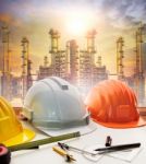 Engineer Working Table Plan, And Oil Refinery Plant In Heavy Petrochemical Industry Stock Photo