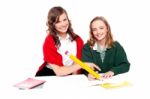 Smiling Girls Learning Books Stock Photo