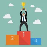 Winner Businessman With Winning Throphy Stand On A Podium Stock Photo