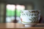 Bowls On A Wooden Desk And Living Room Background Stock Photo