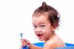 Baby And Toothbrush Stock Photo