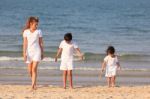 Asian Family On Beach Stock Photo