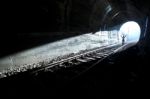 Man Standing In Train Tunnel Stock Photo