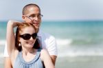 Young Couple At The Beach Stock Photo