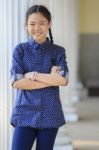 Portrait Of Thai 12s Years Girl Wearing Blue Shirt Standing Out Door With Toothy Smiling Face Happiness Emotion Stock Photo