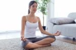 Beautiful Young Woman Doing Yoga Exercises At Home Stock Photo