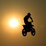 Motorcycle Jumps In The Air Stock Photo