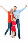 Beautiful Smiling Family. Father, Mother And Daughter Stock Photo