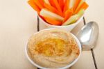 Fresh Hummus Dip With Raw Carrot And Celery Stock Photo