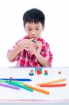 Child Moulding Whale Modeling Clay, On White Background. Strengt Stock Photo