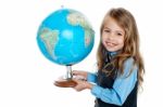 Beautiful School Going Kid Holding Globe Stock Photo