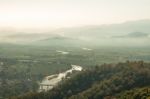 Landscape With Green Feild And Hill In Foggy Stock Photo