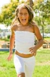 Little Girl Running In Outdoor Stock Photo