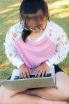 Girl Working With Laptop On Grass Stock Photo