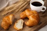 Tasty Croissant And Coffee Still Life Rustic Stock Photo