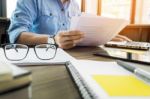 Young Handsome Business Man Working With Documents In The Office Stock Photo