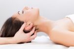 Woman Enjoying Massage At Beauty Spa Stock Photo