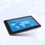 Tablet And World Map Stock Photo