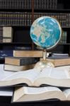 Pile Of Books And Globe Stock Photo