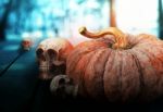 Pumpkin And Skull On Wooden Stock Photo