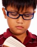 Kid Reading A Book Stock Photo